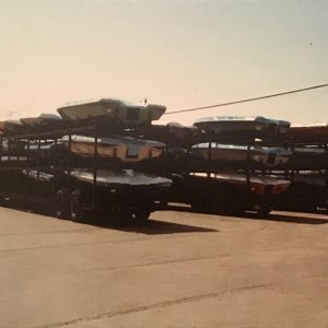 Vintage Boats loaded on trailers.