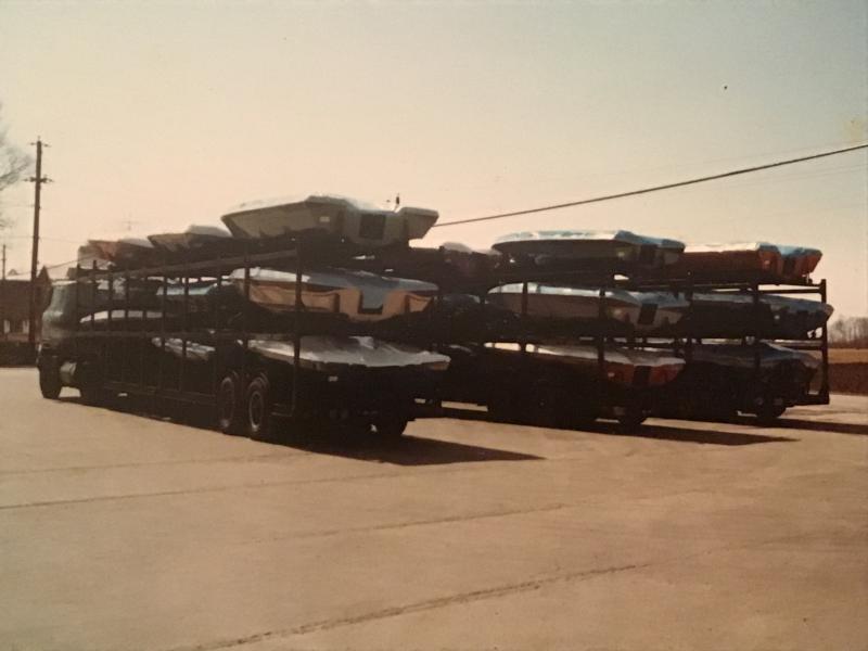 Vintage Boats loaded on trailers.